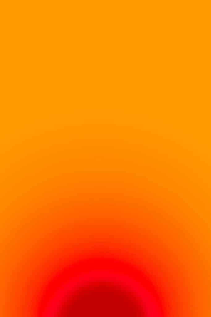 A gradient image with vibrant colors blending from a deep red at the bottom to a bright orange at the top, resembling a sunset effect.