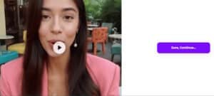 A woman with long dark hair wearing a pink blazer discusses Boca Raton Apartments for Rent during a video call. She sits outdoors among colorful chairs. On the right, there’s a purple "Sure, Continue..." button on a white background.
